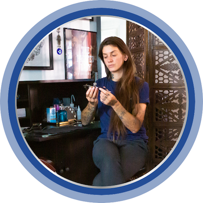 Image of Dominique in the tattoo studio